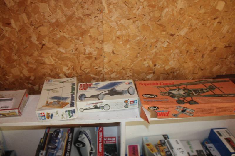 lot 62 image: Lot of (4) Scale Model Kits Includes Ultimates 289 Cobra, Tamiya Solar Powered Dragonfly, Tamiya Solar Car, Guillows British World War 1 Fighter Scale Balsa Kit