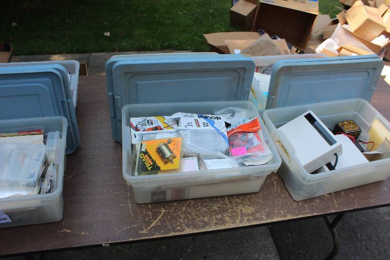 lot 77 image: Lot of (6) Bins of Radio Control Equipment, Supplies Includes Batteries, Controllers, Accessories, Parts, Glue, And More