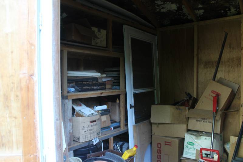 lot 160 image: Items Not Lotted In Shed Includes Bird Feeders, Bird House, Owens Corning Classic, Motor, Hard Hat, Sprayers, Paint Trays, And More