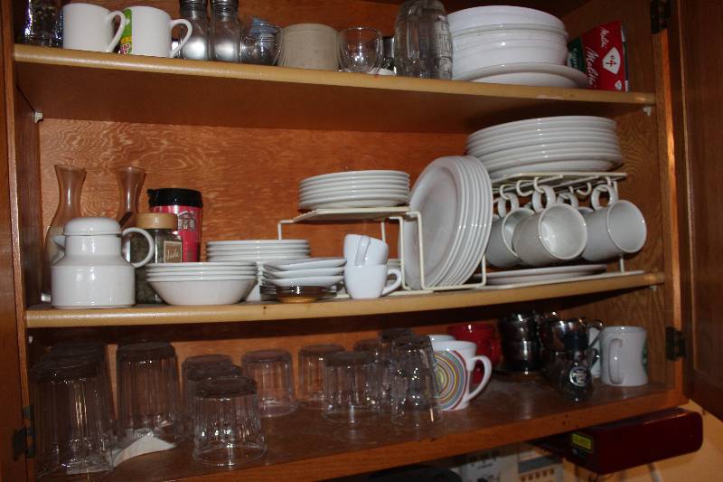 lot 182 image: Contents of Cupboard Includes Plates, Mugs, Bowls, Saucers, Glasses, Large Bowls, Condiment Servers, And More