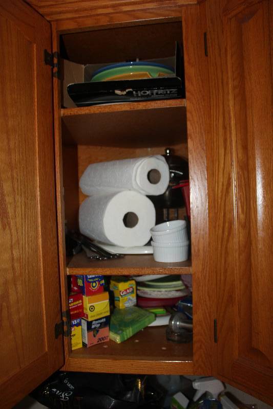 lot 183 image: Contents of Cupboard Includes Paper Towels, Aluminum Foil, Glad Bags, And More