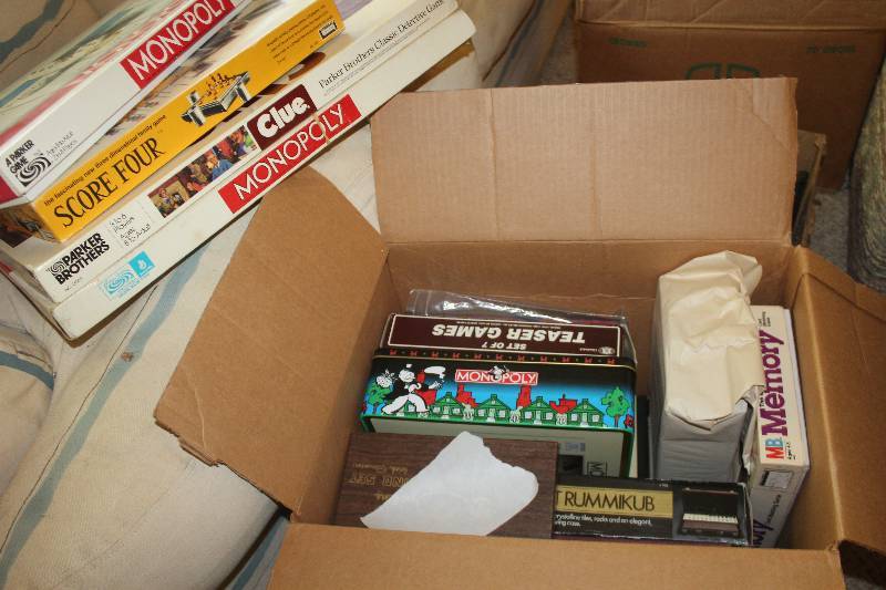 lot 195 image: Box of Board Games Includes Monopoly, Score Four, Clue, And More