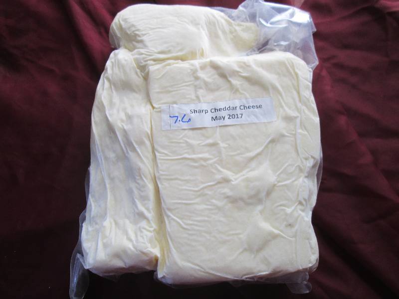 lot 28 image: 7.6 lb.Chunk Sharp Cheddar Cheese P...