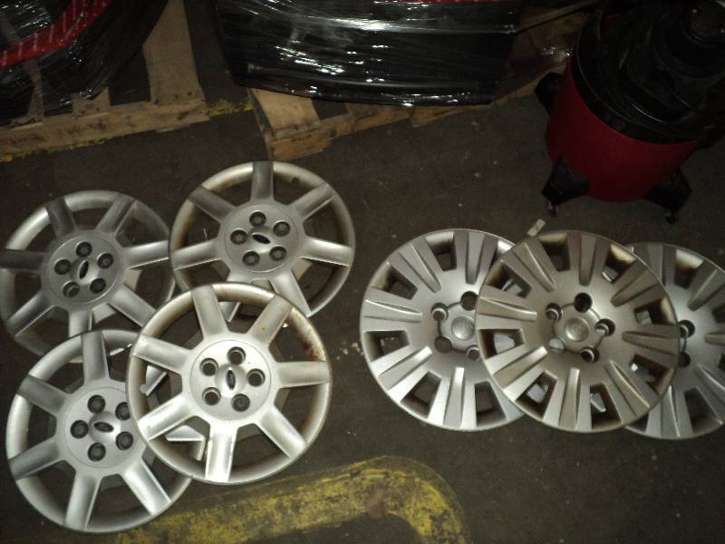 lot 1 image: 7 car tire hubcaps, 4 ford and 3 chrys...