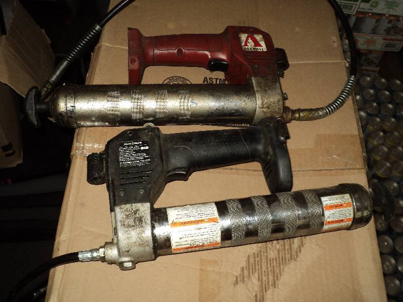 lot 19 image: box of grease guns and air pressure tools...