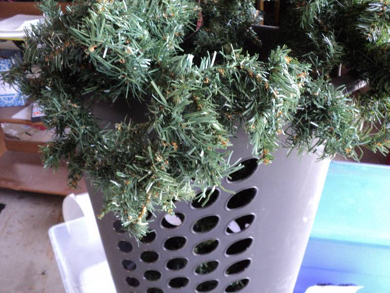 lot 116 image: laundry basket of garland and misc...