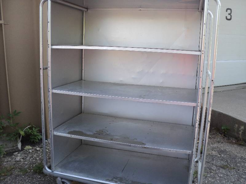 lot 159 image: metal shelving on wheels, 53in wide...