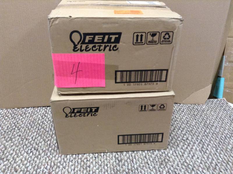 lot 4 image: Lot of 2 Cases of 12 Feit Electric BPESL13T0 Compact Fluorescent Bulb, 15 Watt, Orange Light New