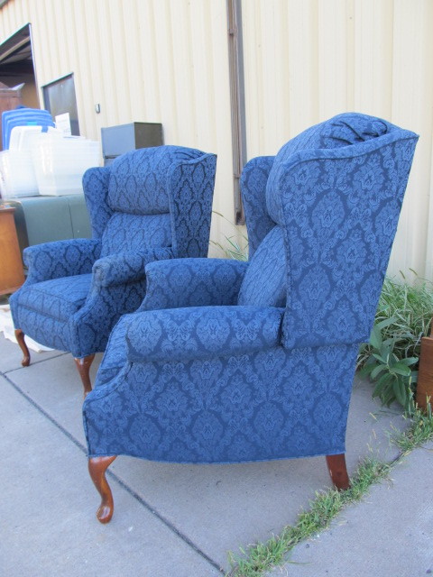 lot 11 image: PAIR Wing Back Reclining Armchairs