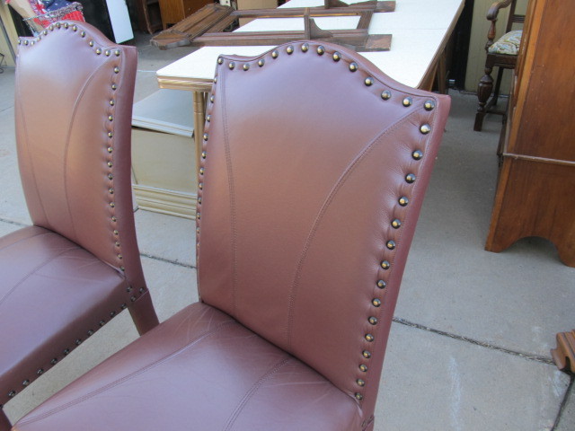 lot 13 image: Pair of High Back Studded Chairs