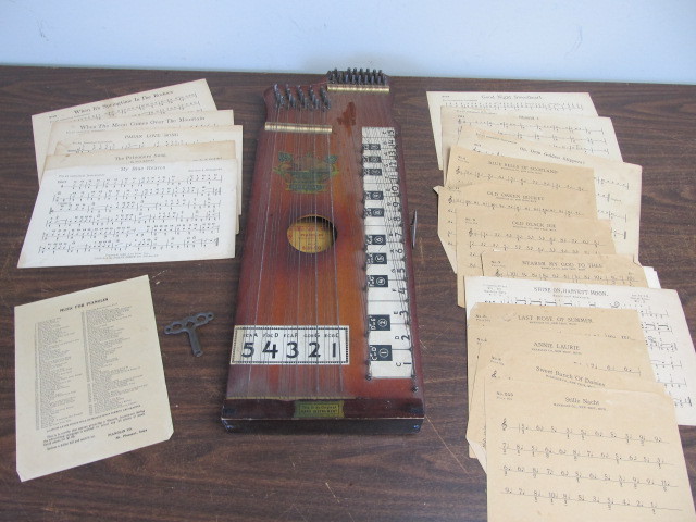 lot 114 image: NICE Antique Pianolin wPatriotic Graphics & Tuning Key