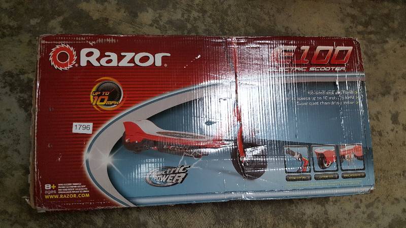 lot 1796 image: Razor E100 12V Electric Scooter  Red