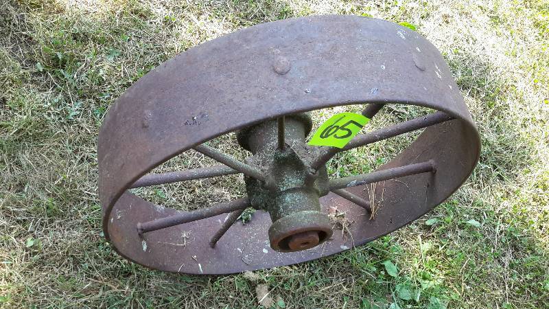 lot 65 image: Wide tread steel wagon wheel.  Approx 6 in w