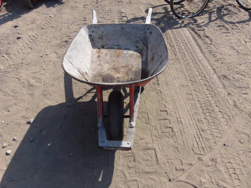 lot 55 image: Orange Wheelbarrow