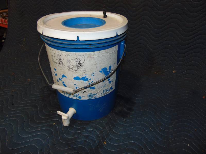 lot 127 image: Bucket With Spout and Valve Stem