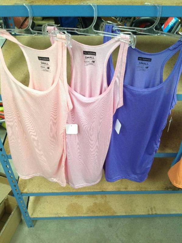 lot 81 image: 3 New Balance Revolution in Motion tank tops Small, new with tags.
