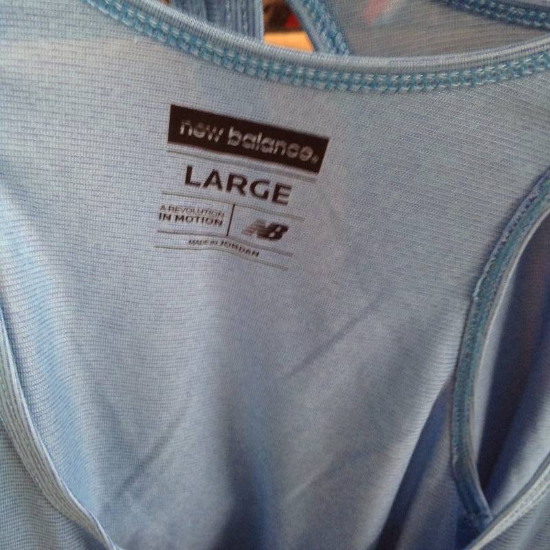 lot 85 image: 4 New Balance Revolution in Motion tank tops Large, new with tags.