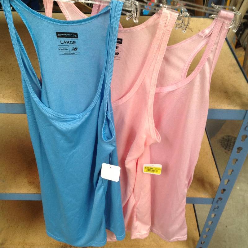 lot 86 image: 3 New Balance Revolution in Motion tank tops Large, new with tags.