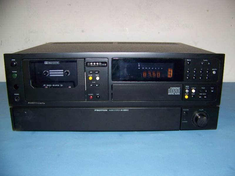 lot 42 image: Proton, AMFM Receiver  CD Player  Cassette Tape Deck with (2) Proton Loudspeakers  Speakers with Remote Control