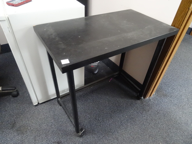 Table on wheels. 32 x 18 x 30...