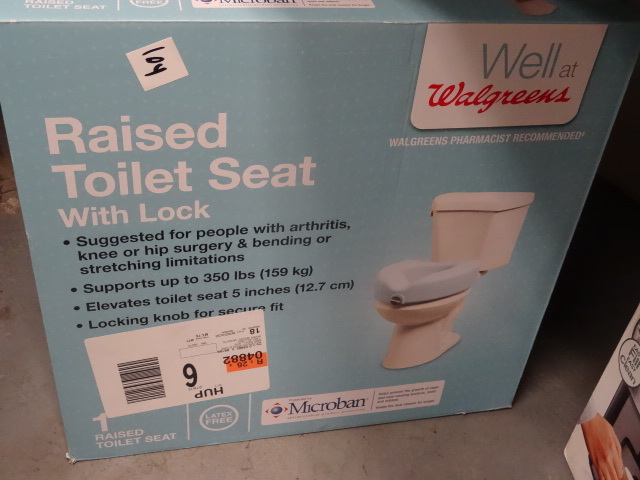 lot 104 image: Raised toilet seat wiith lock...