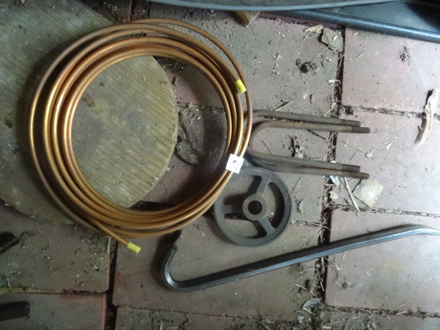 lot 127 image: Roll of new copper tubing. Crow bar...