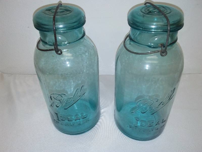 lot 54 image: Vintage Blue Glass Ball Mason Jars (2) bail handles and glass lids half gal. size