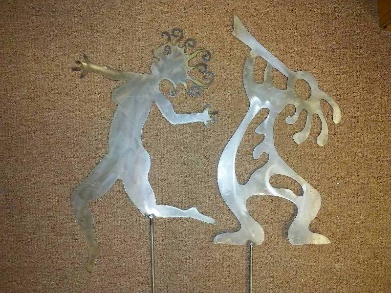 lot 75 image: Aztec Metal Yard Garden Art, (2) Flute PLayer and Dancing Temptress, 55 tall