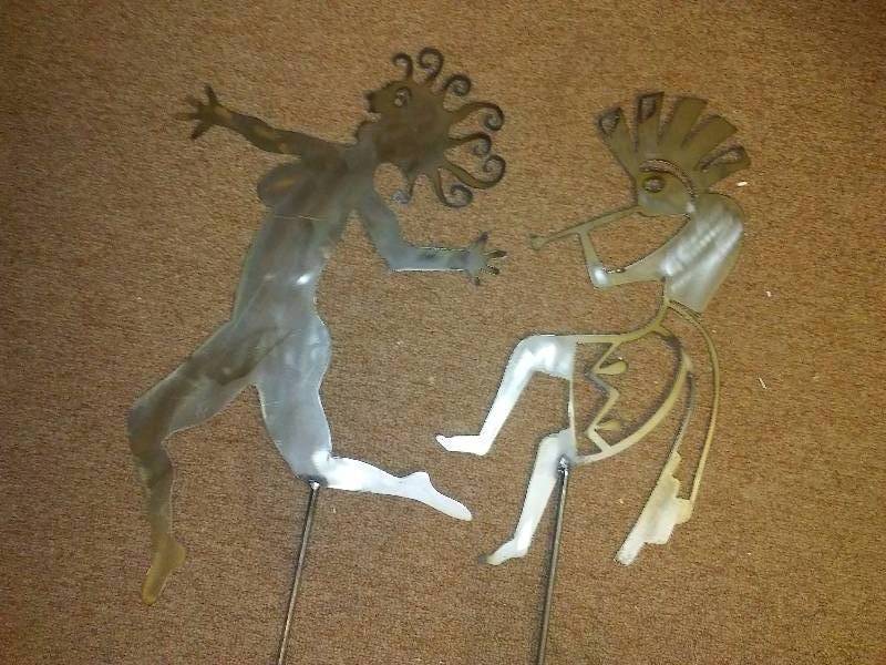 lot 76 image: Aztec Metal Yard Garden Art, (2) Flute PLayer and Dancing Temptress, 55 tall