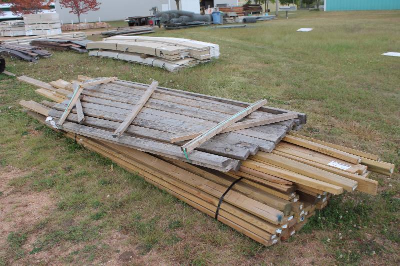 Lot of (Approximately 60) Treated 2x4in. Wood Boards