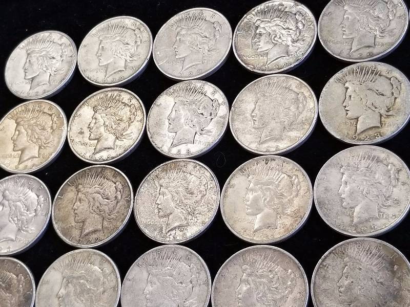 GROUP OF 24 US PEACE SILVER DOLLARS AS PICTURED