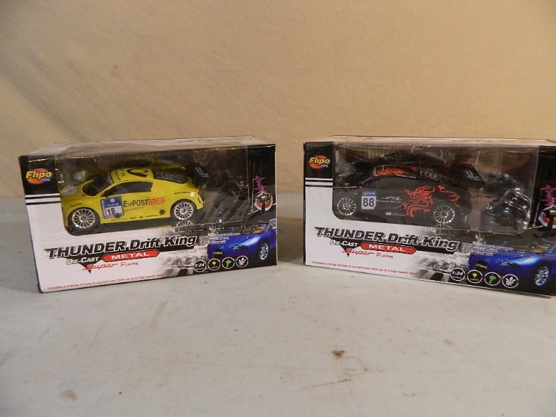 lot 140 image: 2 New Thunder Drift King Metal RC Cars
