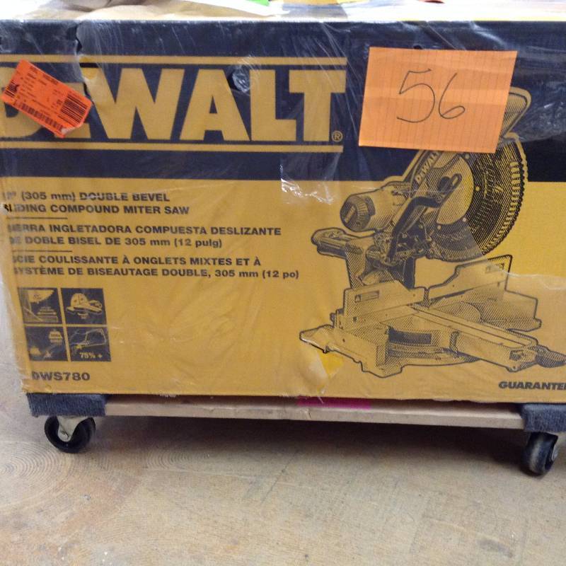 lot 56 image: Dewalt 15 Amp 12 in. Double Bevel Sliding Compound Miter Saw Not used