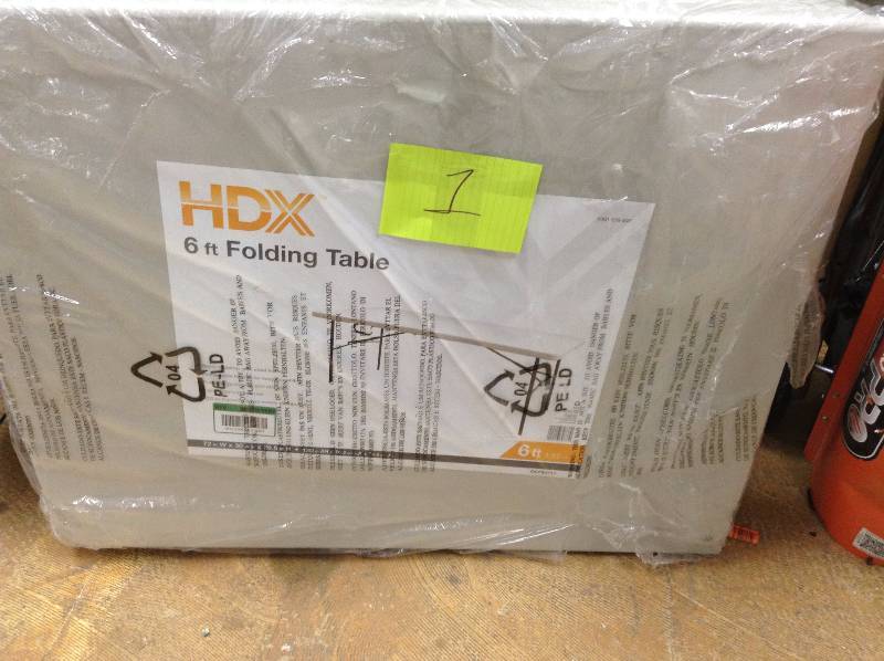 lot 1 image: HDX 6 ft Folding Table never used