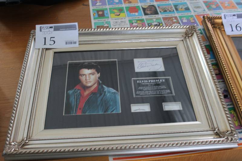 lot 15 image: Elvis Presley The King Of Rock N Roll 1935-1977 Commemorative Framed Matted Glass-face Wall Art w Strands of Hair, Piece Of Towel Worn During Haircuts