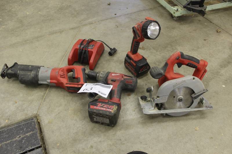 lot 63 image: Milwaukee Tools 28V Cordless Tools w Charger Includes Circular Saw, Drill, Flashlight, Sawzall
