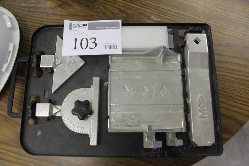 lot 103 image: MK Tile Saw Cutting Fixtures and Jigs.