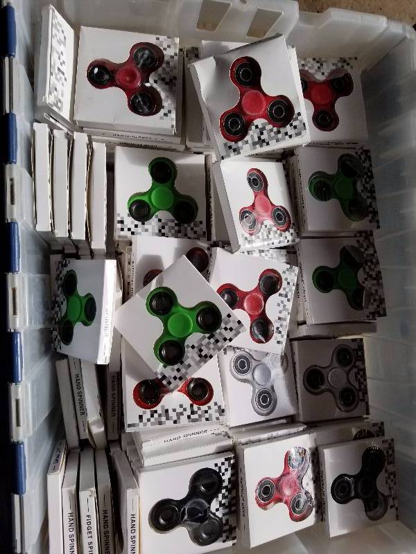 lot 12 image: 54lb tote of spinners - NEW