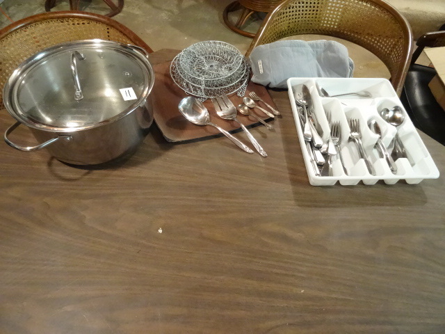Misc kitchen ware. Silverware. Pot....