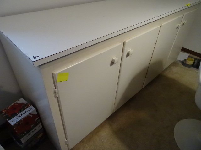 Wood 4 door cabinet. Laminate top. ...