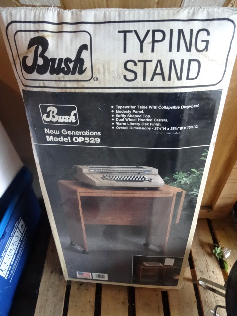 Typing stand in box. Needs assembly...