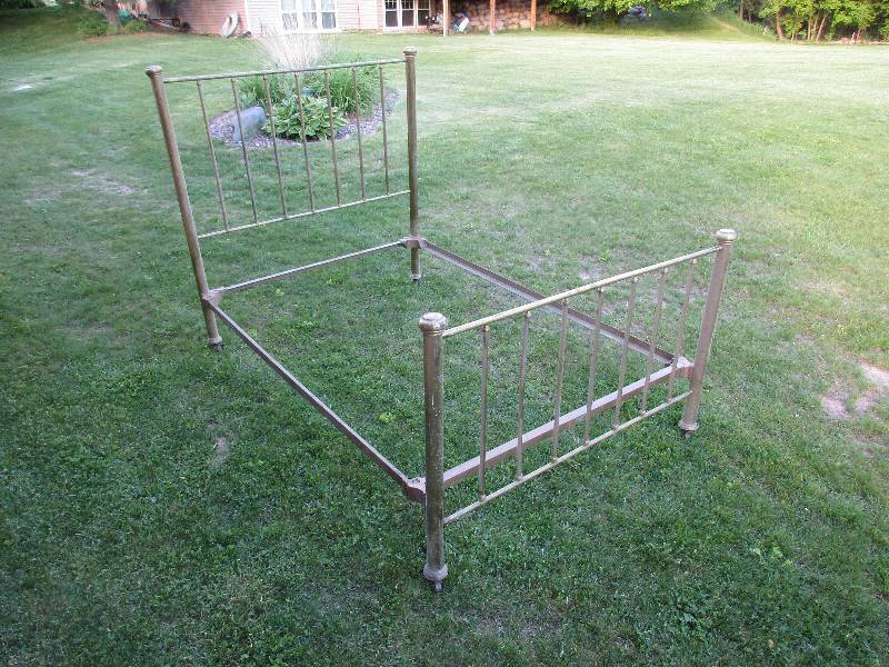 Antique brass bed. Headboard, footb...