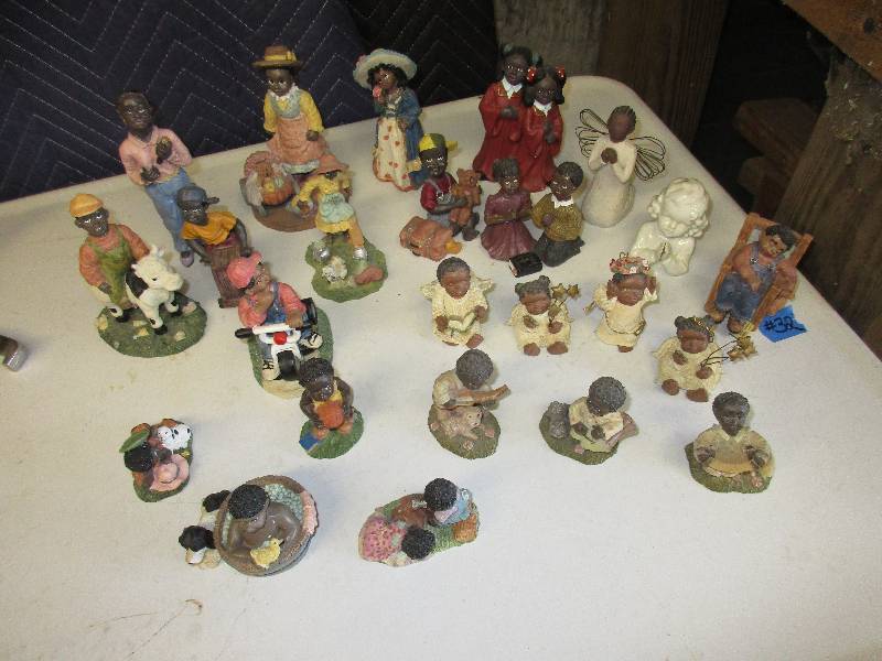 24 Black african fugurines...