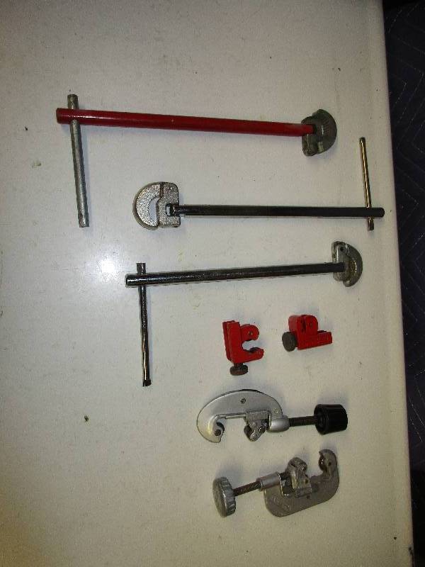 Pipe cutter. Plumbing wrenches...