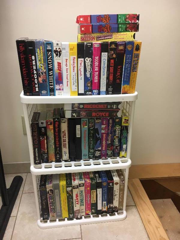 lot 104 image: Lot of VCR Tapes and Shelf