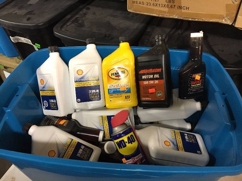 lot 293 image: Tote of Oil, WD-40 & Smoke Treatment