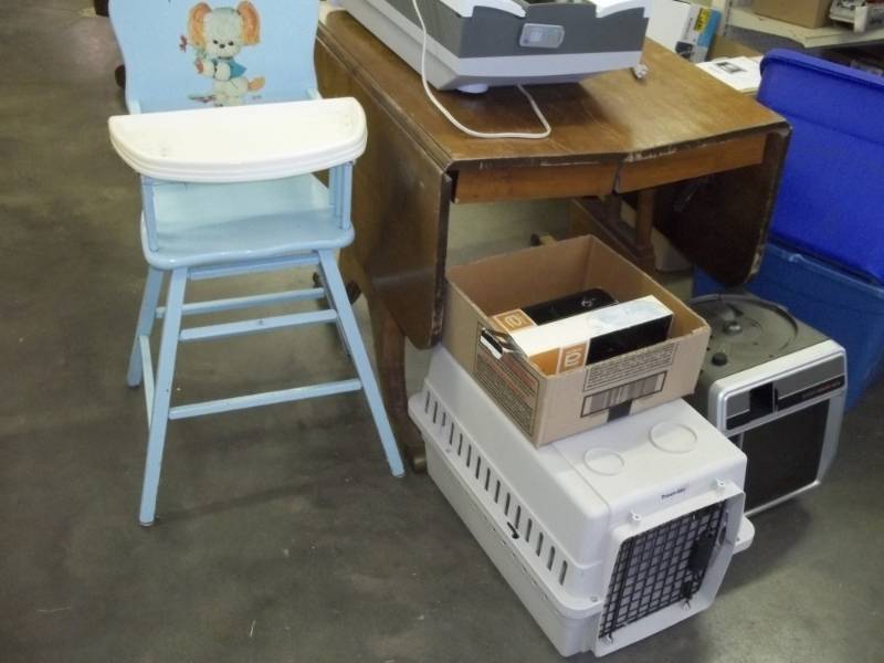 lot 30 image: Vintage Dropdown table, Small pet Carrier, Air Cleaner, vintage high chair, and Slide projector with slide trays.