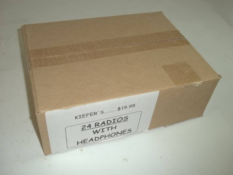 lot 52 image: 24 Radios with Earphones