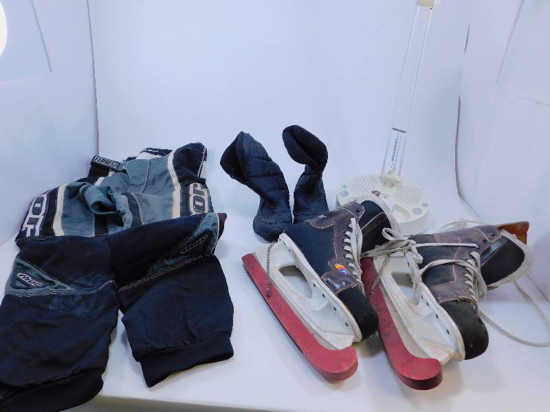 lot 111 image: Thor Motocross Pants Size 32, Hockey Skates, Boots, and a Light