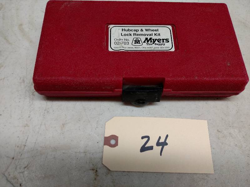 lot 24 image: Myers 2-703 Hub Cap & Wheel Lock Re...